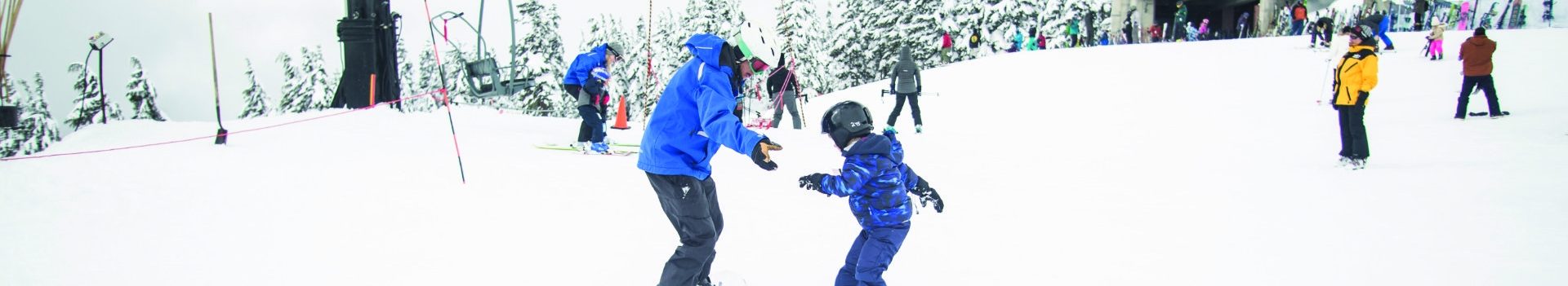 Banner ski instructor with child